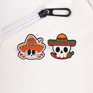 Enamel pin set featuring Mexican day of the dead skull and sombrero for backpack decor
