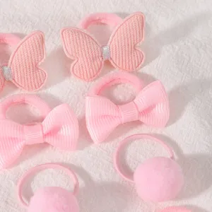 Close-up detail of cute pink hair ties set featuring butterfly and bow accents for girls.