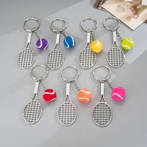 Detailed shot of colorful tennis racket keychains with miniature balls, stylish metal bag pendants
