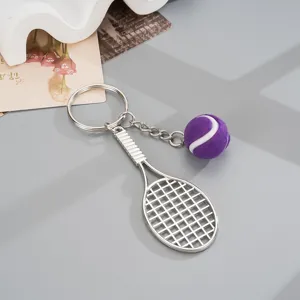 Metal tennis racket keychain with purple fuzzy mini tennis ball pendant for bags keys.