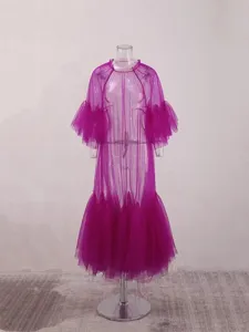 Detailed view of the purple sheer mesh tiered dress, highlighting the delicate layered ruffles.