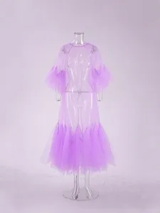 Close-up detail of the purple sheer mesh long sleeve dress featuring stylish ruffled layers.