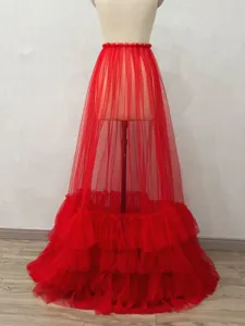 Detail view of the red sheer mesh tiered skirt, showcasing transparent layered ruffles and design.