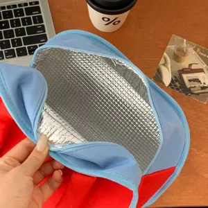 Insulated lunch bag with aluminum foil interior, blue and red portable bento handbag for work.