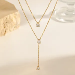 Exquisite double-layer teardrop zircon necklace, delicate gold clavicle chain detail.