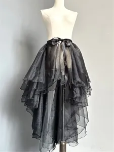 Black high-low tulle skirt overlay, sheer mesh fabric with waist ribbon tie detail.