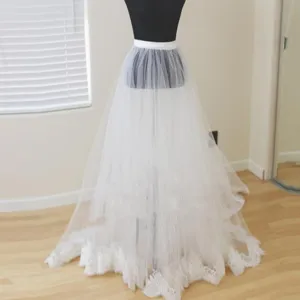 White bridal detachable tulle overskirt with delicate lace hem, elegant wedding dress skirt.