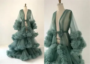 Elegant sage green tulle maternity photography dress with tiered ruffles and long sleeves.