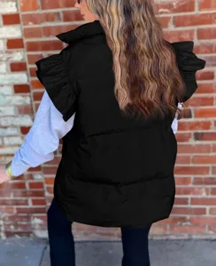 Stylish black puffer vest for women featuring trendy ruffled shoulders and a chic stand collar.
