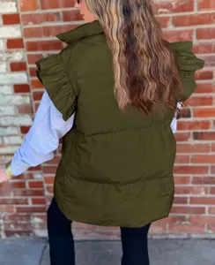 Close-up of the army green puffer vest featuring ruffle sleeves, stand collar, and padded texture.