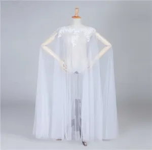 White mesh lace applique cape detail, elegant bridal cloak showcasing exquisite craftsmanship.