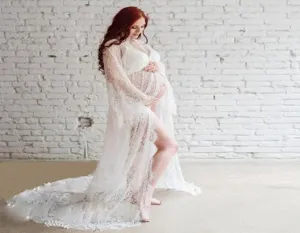 White lace sheer maternity dress with long sleeves and train for beach photography.