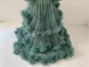 Detailed view of the layered tulle cake skirt, featuring fluffy ruffles for photography and stage use.