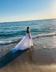 Elegant white tulle bridal skirt with long train, perfect for beach wedding and photos.
