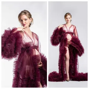 Close-up detail shot of deep red mesh ruffled maternity robe sleeves and long train.