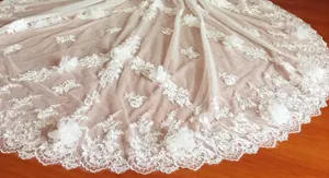 Detachable wedding dress train with white lace applique and 3d floral petals for brides.