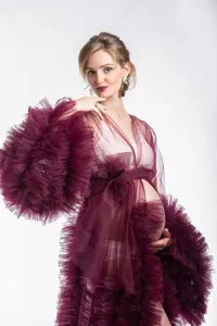 Elegant long mesh ruffle belted maternity dress with deep V and big sleeves for photography.