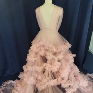 Elegant pale pink tulle ruffled long train deep V evening gown wedding dress photography.