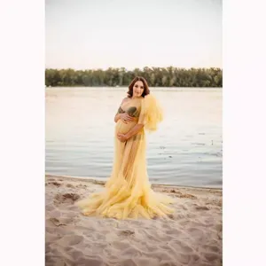 Elegant yellow tulle maternity long dress with dramatic train for photography and baby showers.