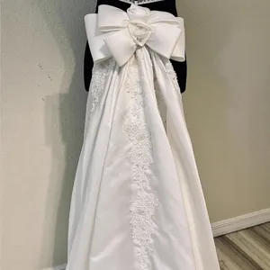 Stunning white satin detachable wedding dress train with giant bow and lace embroidery.