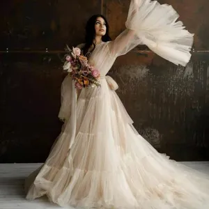 Long mesh dress with deep V-neck and trumpet sleeves, perfect for photography and maternity.