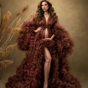 Detail view of the luxury brown maternity tulle dress featuring voluminous ruffles and bow.