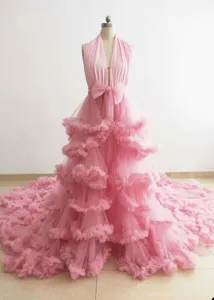 Pink halter neck tiered tulle gown with large train, exquisite layered ruffle design.