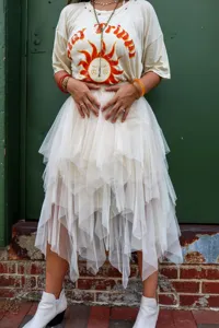 Close-up of the layered mesh tutu skirt featuring irregular hem and elegant high waist.