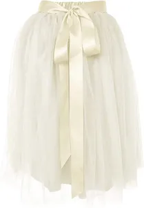 Detail shot of white mesh tutu skirt with satin bow belt for women's stage performance.