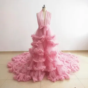 Stunning pink halter mesh long trailing dress for elegant photo shoots and maternity wear.
