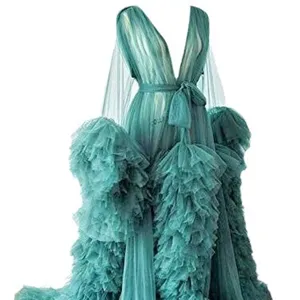 Luxury bridal tulle morning robe with long sleeves, deep V-neck and dramatic ruffled train.