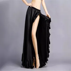 Detail view of black high slit dance skirt with stylish ruffles, elegant and flowing fabric.