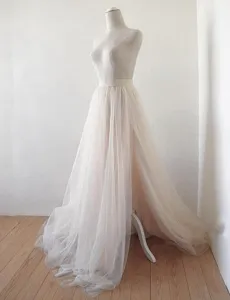 Elegant tulle bridal skirt detail, high front slit design, flowing long mesh maxi skirt.