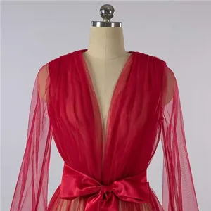 Detailed view of the elegant red sheer tulle long sleeve bridal robe with a satin bow belt.