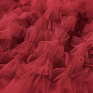 Women red mesh tiered skirt close-up fabric texture elegant fluffy cake skirt fashion