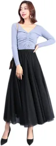 Women solid color elegant two layer tulle long skirt paired with v-neck knit top daily wear