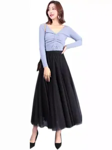 Elegant women's light blue knit top and black mesh maxi skirt set for summer chic style.