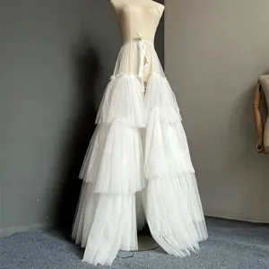 Detailed view of the white multi-layer tulle petticoat, showing tiered fabric texture.