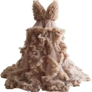 Exquisite ruffle tulle maternity dress detail, layered mesh voluminous design for photo studio.