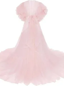 Detailed shot of the pink tulle maternity dress, showcasing the layered ruffles and long train.
