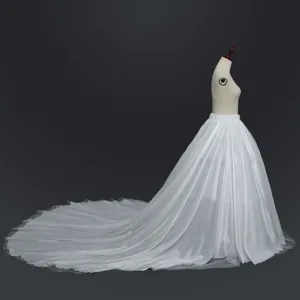 Detailed view of white mesh long train skirt, high waist design for elegant dance styling.