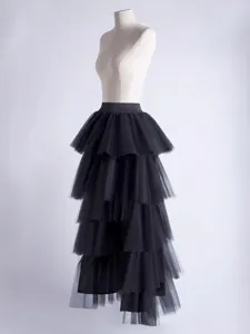Elegant black tiered tulle skirt on mannequin, perfect for travel, dancing, and parties.