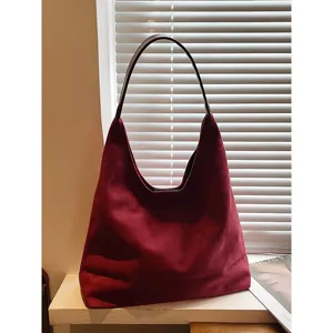 Elegant red suede hobo shoulder bag, large capacity retro commuting tote for women.