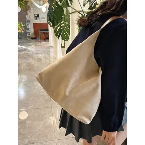 Beige suede shoulder bag for women, large capacity vintage hobo tote bag for daily commute.