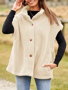 Close-up detail showing the texture and front button closure of the warm fleece vest.