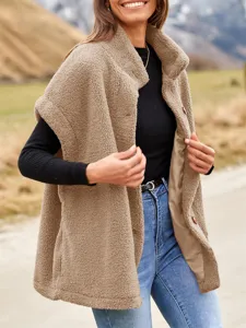 Detail view of women's warm sherpa fleece sleeveless vest in chic camel color outdoor.