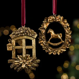 Gold vintage Christmas resin hanging ornament detail view with exquisite rocking horse design