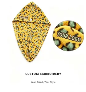 Detailed view of leopard microfiber dry hair towel featuring custom embroidery logo.