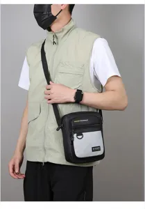 Mens casual crossbody bag detail showing durable fabric, zipper pockets and adjustable strap.