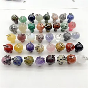 Detailed close-up view of various natural crystal stone mini mushroom pendants for jewelry DIY.